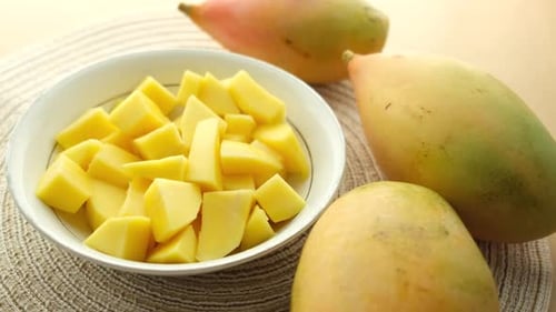 Yellow Ripe Cut Mango in a Bowl Top Down