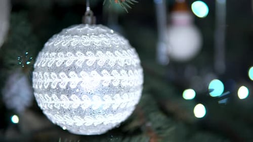 Creative shiny silver christmas eve decor ball hanging closeup
