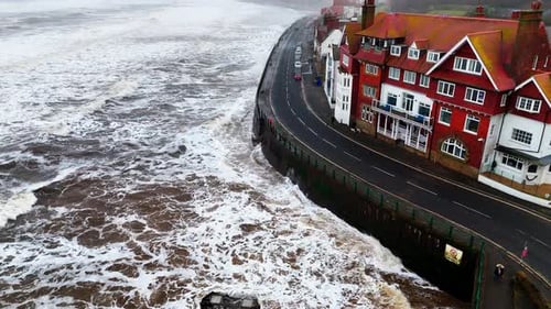 Stormy winter scene. Rough seas of the English coast with mist and fog. Aerial footage of the sleepy