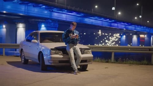 Solitary Man Repairing Vehicle Under Illuminated Bridge at Dark Night Lone Man Working on His