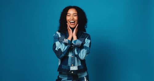 Woman, face and wow for surprise in studio, announcement or mockup space on blue background