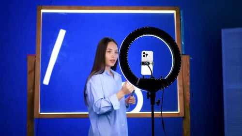 Young Woman Speaking in Studio with Ring Light