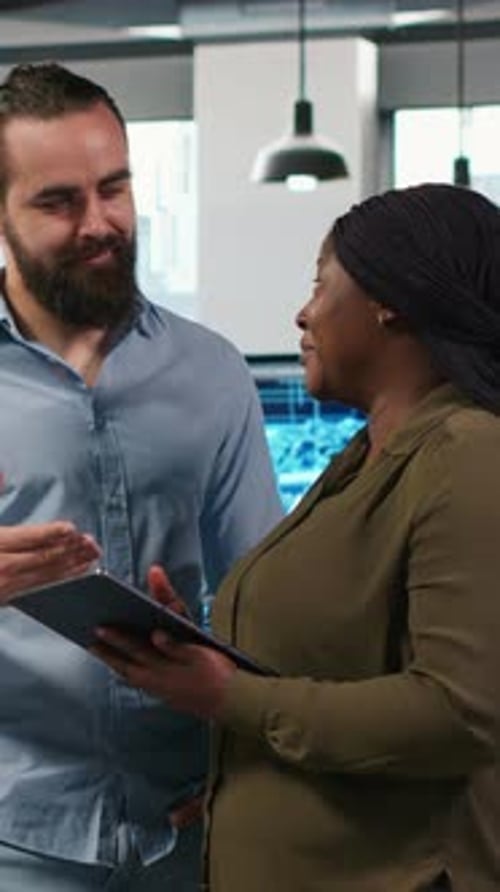 Vertical Video Team of Programmers in Office Automating Repetitive Tasks Using AI Scripts