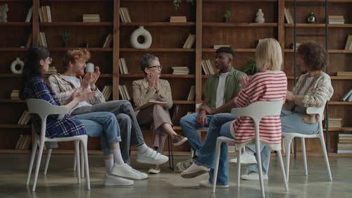 Counselor Leading Group Therapy Session with Diverse Adults