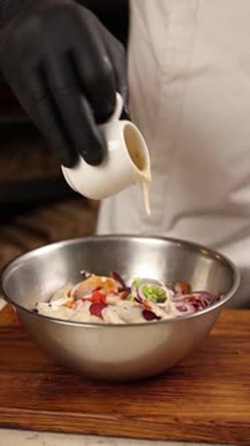 Chef prepares a delicious salad in a restaurant