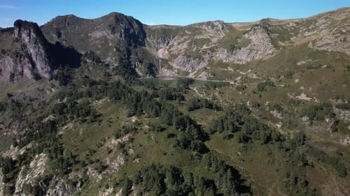 Aerial views of an alpine lake in the french Pyrenees at low altitude