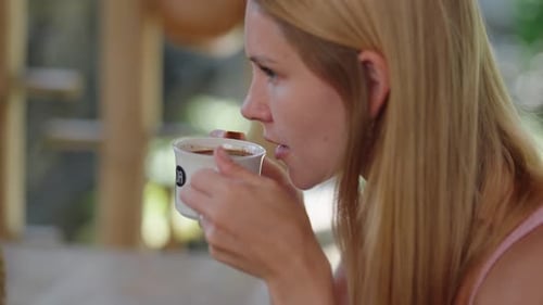Woman Drinking Traditional Black Coffee in Asia
