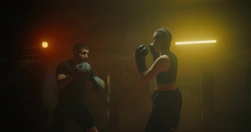 Woman in Fight Club Hard Training with Coach Sportswoman Practicing Punches Prores