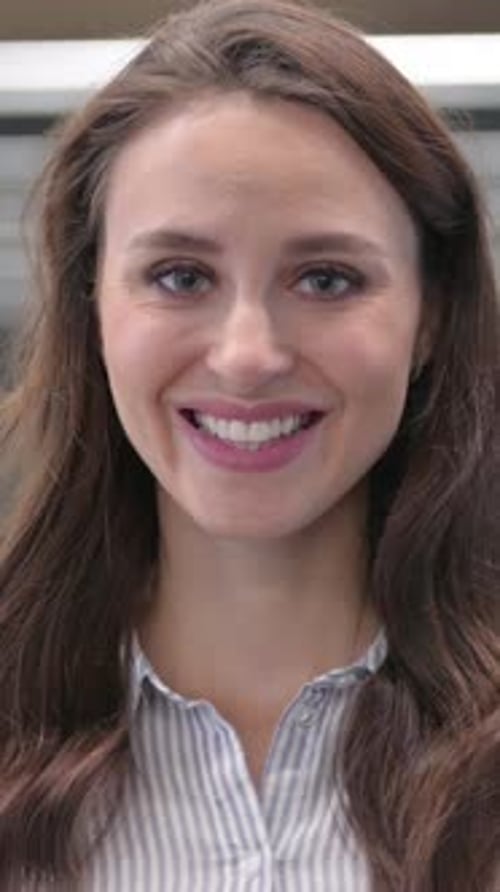 Portrait of Attractive Young Woman Smiling at Camera in Cafe, Vertical Video