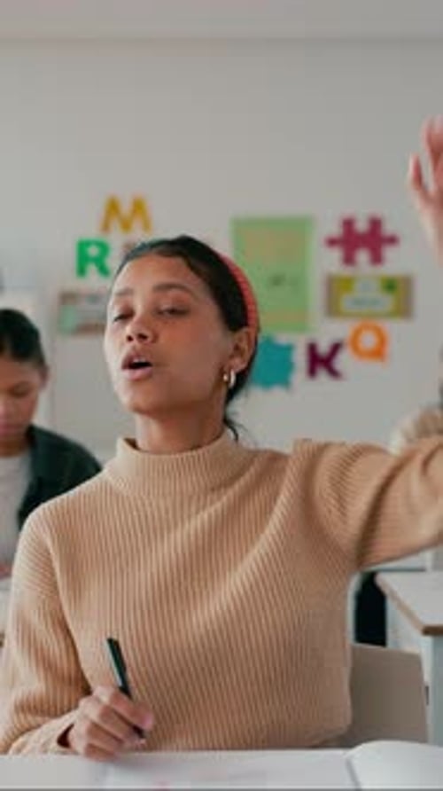 Raised hand, education and question with student in classroom for learning