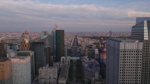 Aerial Footage of Metropolis at Dusk Backwards Reveal of Modern Skyscrapers in Futuristic La Defense