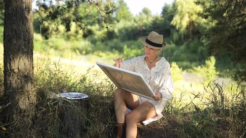 A Woman Artist Paints a Picture During Sunset Artist Art for Sale Inspiration in Nature