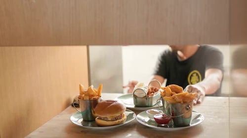 Fresh Burger and Fries in Restaurant Setting