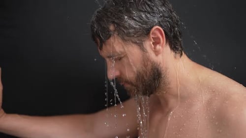Man Washing Hair Under Shower Water