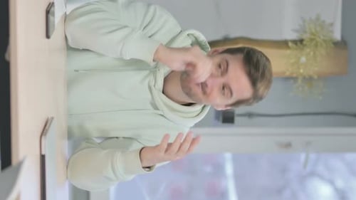 Young Adult Speaking with Hand Gestures