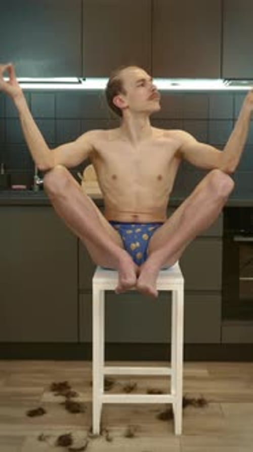 Man Sitting on Stool in Meditation Pose