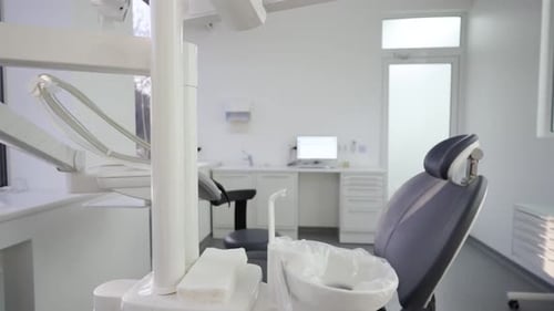 Dental Chair in Modern Dentist Office with Professional Equipment Dentist's Office Interior with