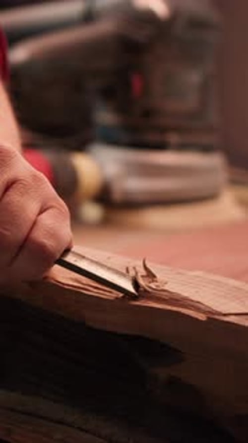 Vertical Video Manufacturer in Studio Shaping Wooden Pieces with Tools Close Up