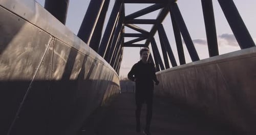 Adult man running athlete sprinting workout challenge training endurance in urban city