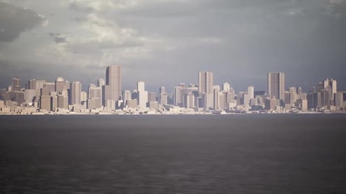 City Skyline at Dusk Overlooking Water with Modern Architecture and Clouds