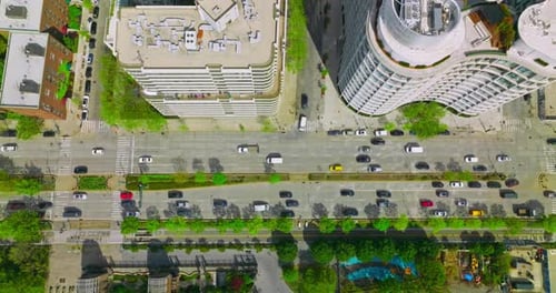 Numerous cars driving along the busy roads. Crazy traffic of metropolis at daytime.