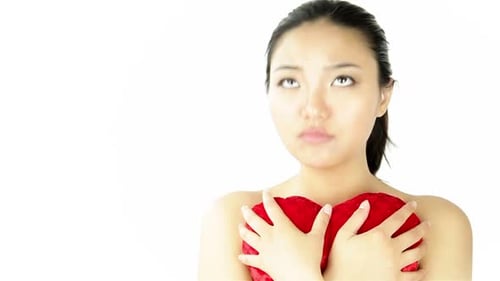 Attractive woman from east asia in her 20s isolated in studio