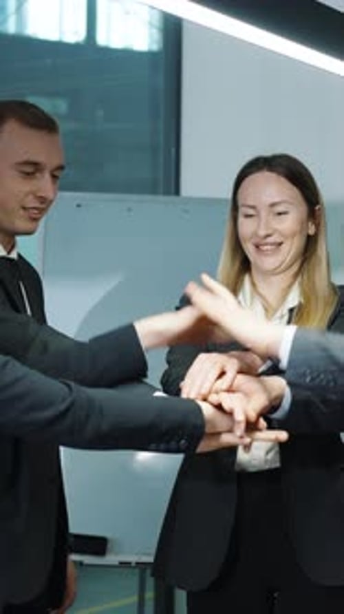Vertical Screen Motivated Business Team Putting Hands in Stack