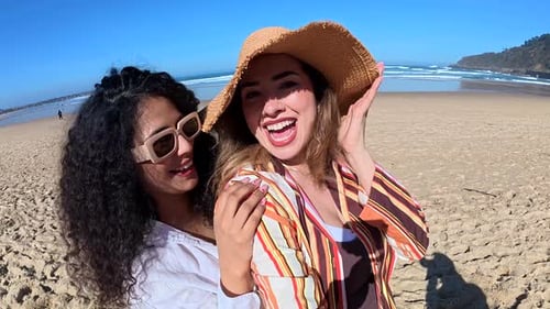 Happy Female Friends Taking Selfie Video on the Beach