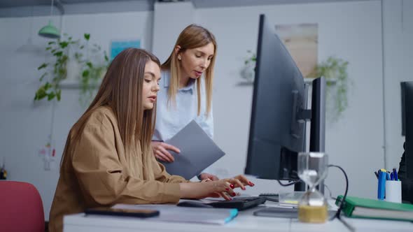 Women Manager And Programmer Discussing Project Making Corrections ...