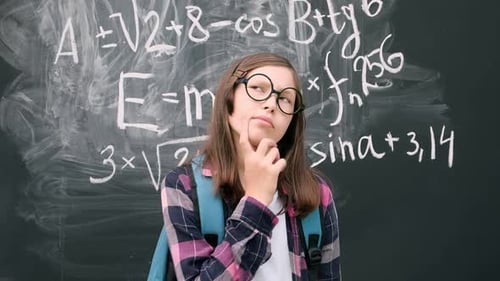Pensive Student with Math Equations on Chalkboard