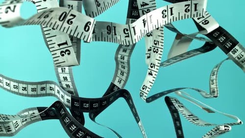 Floating Measuring Tapes on Blue Background