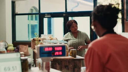 Customer Checking Organic Bio Merchandise in Grocery Store