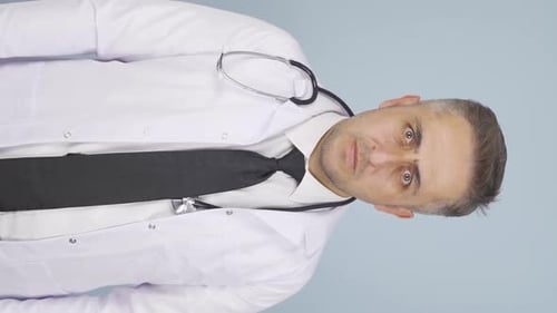 Concerned Doctor Shakes Head and Points Finger