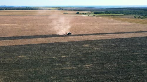 Tractor Plowing Field in Cultivated Land and Soil Tillage
