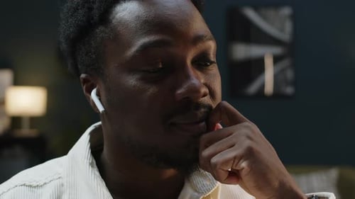 Adult Man Wears Wireless Headphones Indoors