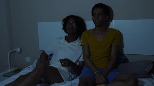Couple Reacting with Fright While Watching TV