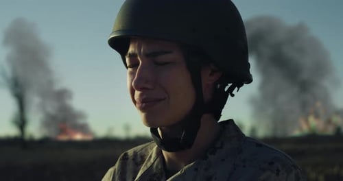 Slow Motion Close Up Portrait of Female Soldier in Distress in a War Zone Field Strong Woman in