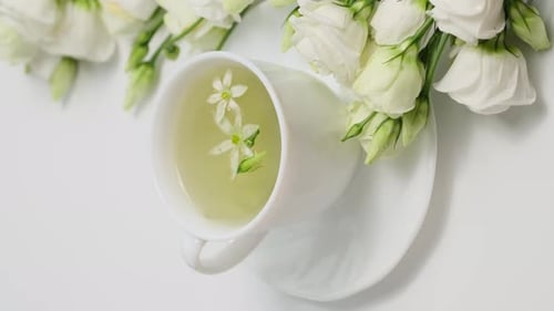 White Tea Cup with Flowers Close Up