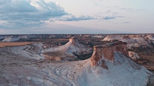 Behold the Stunning Aerial View Showcasing Unique Rock Formations Against the Backdrop of Dusk