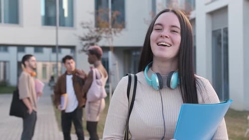 Smiling Student with Friends on College Campus