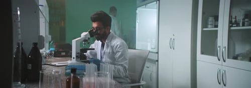 Scientist Working in Bright Modern Medical Research Lab