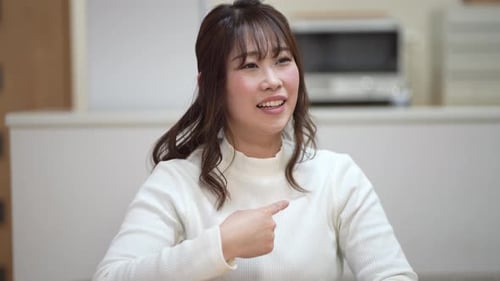 Woman Communicating Using Sign Language Indoors
