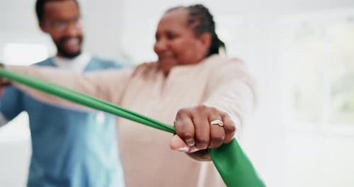 Physiotherapy, hand and resistance with a black woman in a clinic for rehabilitation