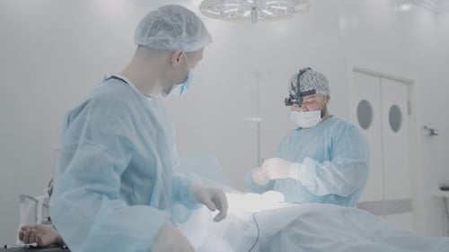 Surgeons Performing Operation in Modern Hospital Operating Room