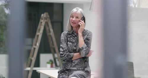Senior Woman Talking on the Phone Indoors