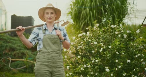 Satisfied Gardener Holding Hoe Poses