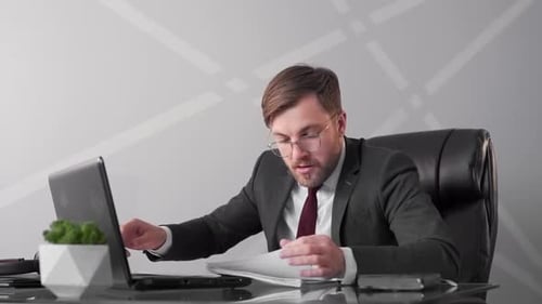 businessman looking through documents psychologically can not stand and is frustrated