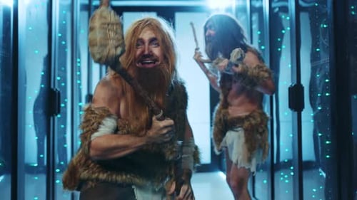 Two men dressed as cavemen in server room