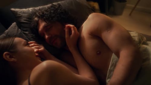 Couple Lying Together in Bed at Night