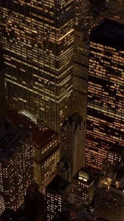 Stunning Night View of Beautifully Illuminated Skyscrapers in a Vibrant Urban Landscape